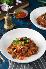Traditional Caucasian dish-stewed beans with pepper and tomatoes, Lobio. Selective