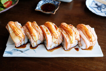 Fresh Salmon Sushi Roll that is a Famous Japanese Recipe.