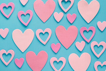 Fototapeta na wymiar Valentines day hearts pattern on blue background. Valentine's day and love romantic concept.