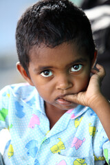 Cheerful funny little boy portrait looking at the camera.