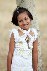 Fototapeta premium Pretty Indian girl in modern dress at outdoor background.