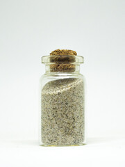 Glass jar filled with sand. Tourism, symbols for memory.