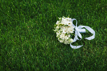 Wedding details. wedding bouquet of various flowers on the grass