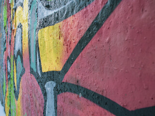 Fragments of a painted wall. Spray-painted wall. Concrete wall texture.