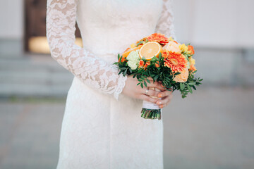 wedding bouquet with oranges in the hands