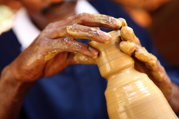 hands of a potter at work