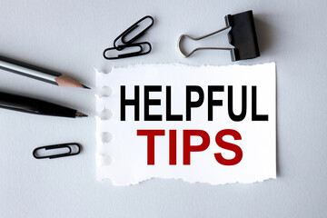helpful tips, text on white paper on gray background