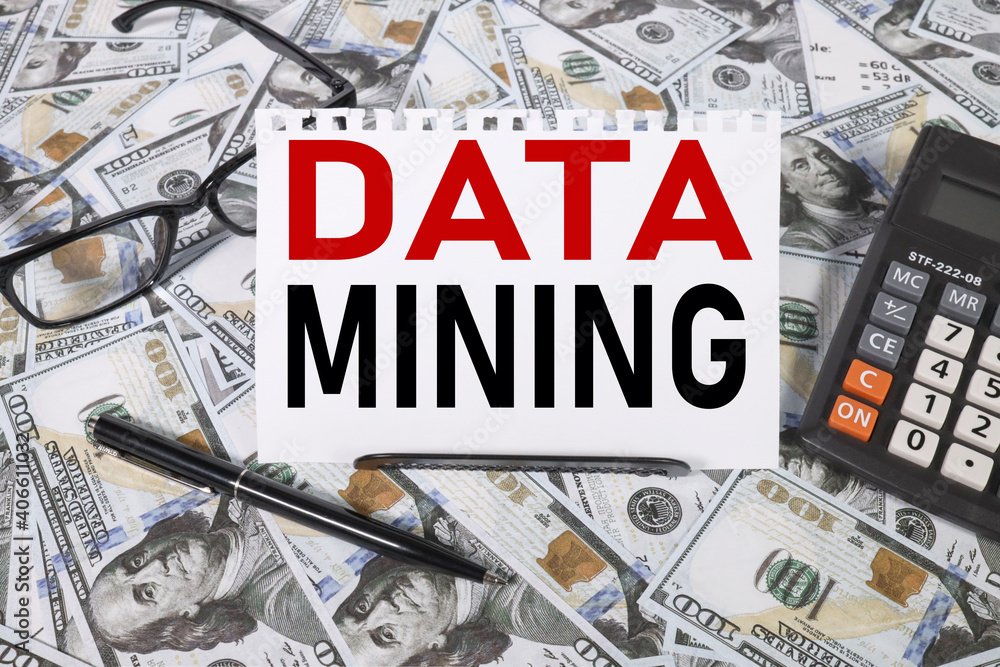 Poster data mining. text on white paper against dollar bills background. calculator. points. office table. 