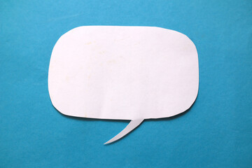 Empty blank color paper speech bubble balloon dialog for your design, flat lay top view