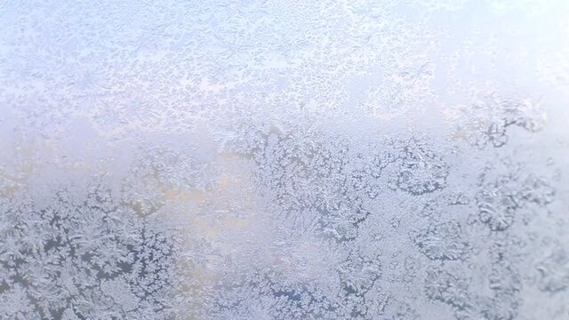 snow pattern on the glass from frost. pattern of snowflakes on the window