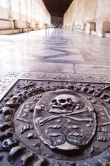 Gravestone in the monumental cemetery in Miracles square in Pisa Tuscany, Italy