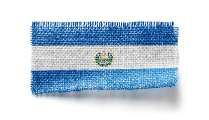 Salvador flag on a piece of cloth on a white background