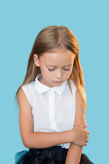 Upset girl. Kids punishment. Mistake regret. Portrait of ashamed sad little child in elegant outfit...