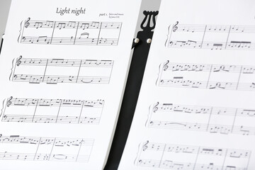 Note stand with music sheets, closeup