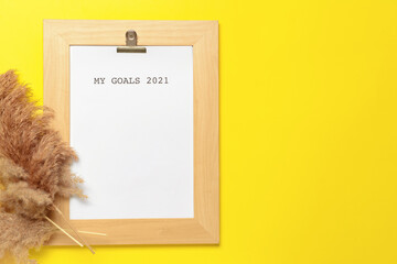 Text MY GOALS 2021 with pampas grass on color background