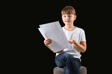 Little actress on dark background