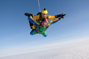 Skydiving. Tandem jump. Two guys are flying in the sky.