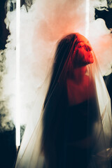 Woman abuse. Defocused art portrait. Self isolation protection. Social pressure. Hopeless lady with...