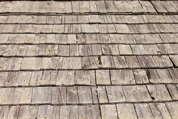 Natural pine wood panels from a wooden roof of a mountain stable