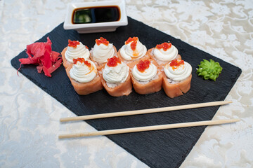Delicious, juicy and appetizing Philadelphia rolls deluxe with red caviar