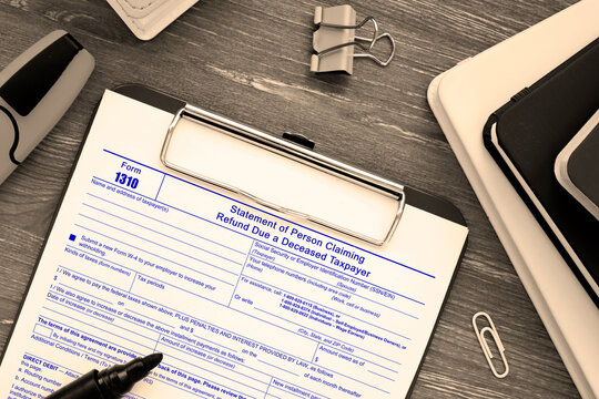  Financial concept about Form 1310 Statement of Person Claiming Refund Due a Deceased Taxpayer with sign on the piece of paper.