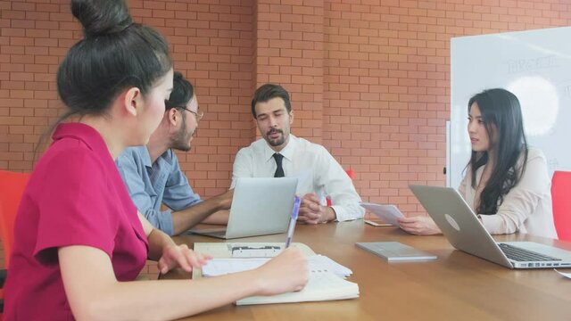 Group of interacial business people meeting in the offfice of company.