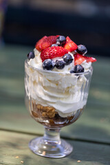 Sweet dessert - meringue with strawberries and blueberries