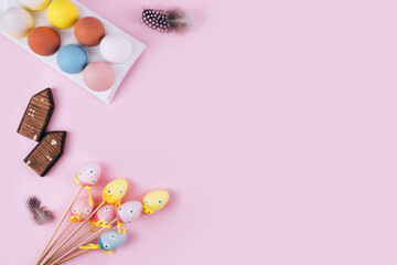 Fototapeta na wymiar Colorful Easter eggs over pink background.
