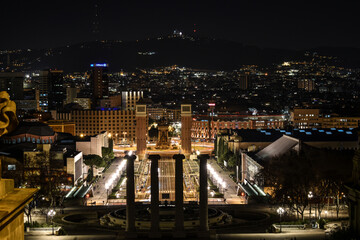 Plaza España in Barcelona photographed at night illuminated by streetlights and buildings.