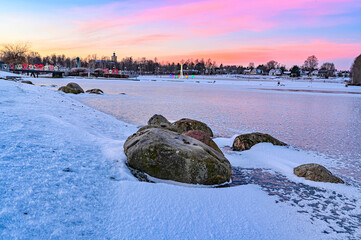 stones near frozen pond at Kumla Park Sweden