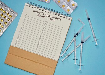 Month of May Doctor's Appointment calendar with medicine