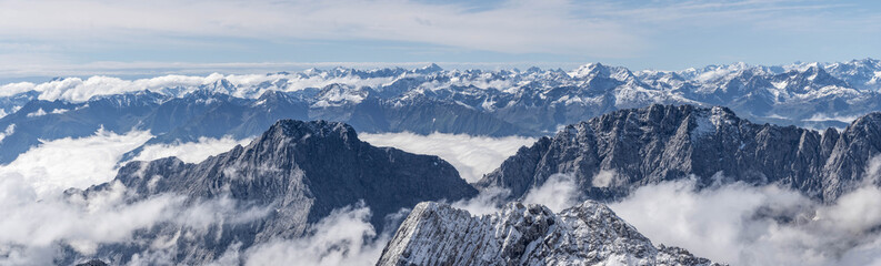 Panorama view of snow mountain range in summer from Top of Germany Zugspitze