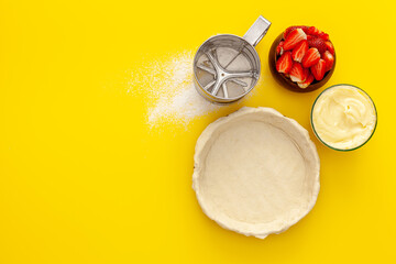Making strawberry gift pie for valentine's day. The cake is decorated with small hearts