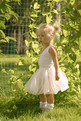 Little girl ballerina in the garden