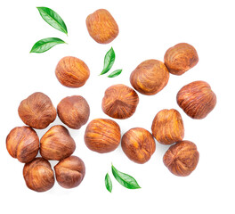 Hazelnuts  with  green leaves isolated  on a white background. Creative food layout. Pattern with...