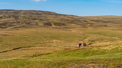 A derelict site trailer near the B6270 road between Nateby and Birkdale, North Yorkshire, England, UK