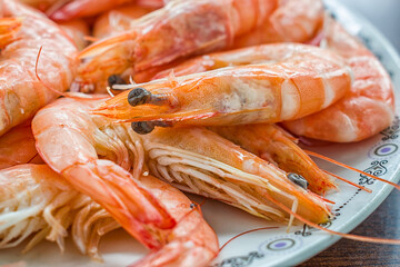 Cooked prawn on a white plate.