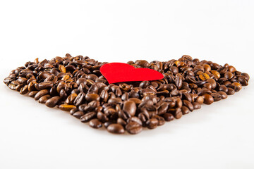 Coffee beans in heart shape with a Small red heart. White background isolated