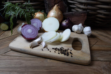 onion and garlic on wooden board
