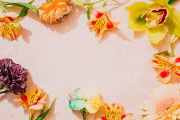 Frame made of flowers pink background