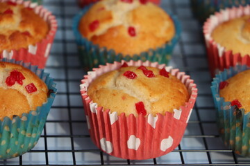 Muffins or cupcakes with cooling rack background, baking concept 