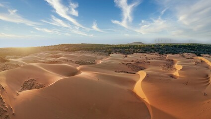 Fototapeta na wymiar Aerial view of Red Sand Dunes (local name is Doi Cat Do), also known as Golden Sand Dunes, is located near Hon Rom beach, Mui Ne, Phan Thiet city