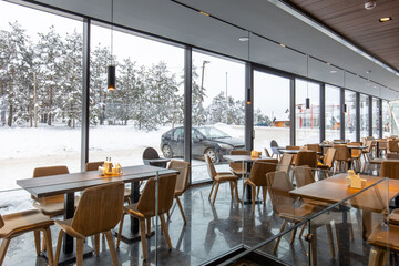 Fototapeta na wymiar Interior of a modern mountain restaurant in the winter