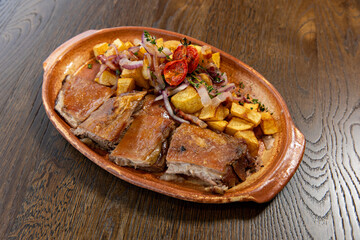 Roasted lamb meat served with fried potato