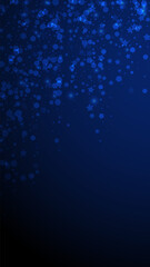 Magic stars sparse Christmas background. Subtle flying snow flakes and stars on dark blue background. Alluring winter silver snowflake overlay template. Symmetrical vertical illustration.