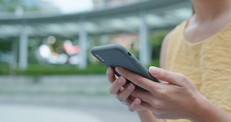 Woman use of cellphone at outdoor