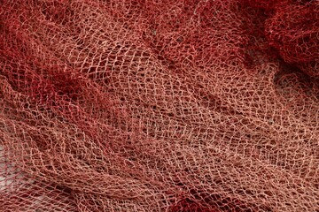 Close up of red commercial fishing nets in Morocco 
