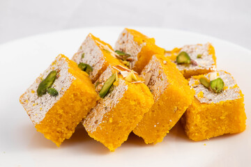 Moong Dal Burfi Or Meetha Mung Daal Barfi Barfee Is Delicious Indian Mithai Enjoyed On Festivals Like Diwali Holi Navaratri Puja And Offered To God During Pooja. White Background With Space For Text