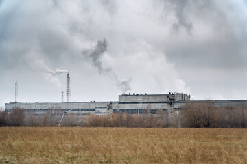 Fototapeta na wymiar View of a chemical plant with Smoking chimneys