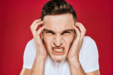 Man in white t-shirt emotions displeased facial expression isolated background